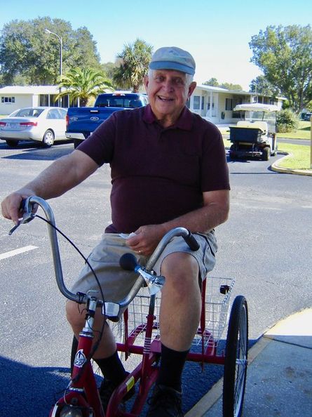 A resident of Forest Glenn enjoys riding his bike through the community.