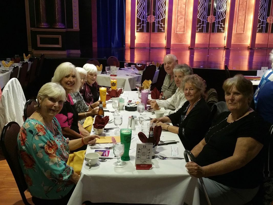 Forest Glenn residents enjoy dinner theater together.